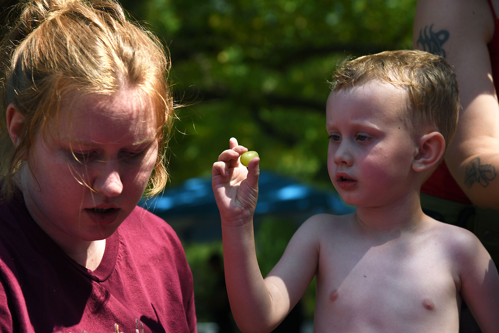 Left to right, Charli Leach and Roran Leach, 4, throw